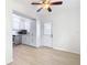 Modern kitchen with white cabinets, stainless steel appliances, and vinyl flooring at 6269 Skyline Ct, Spring Hill, FL 34606