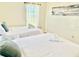 Bright bedroom featuring two twin beds with crisp white linens and plenty of natural light at 6269 Skyline Ct, Spring Hill, FL 34606