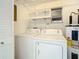 Laundry room with washer, dryer, and extra shelving at 6269 Skyline Ct, Spring Hill, FL 34606