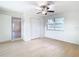 Bright bedroom with ceiling fan, new flooring, and ample closet space at 6269 Skyline Ct, Spring Hill, FL 34606