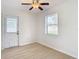 Spacious bedroom with light flooring and a view of the backyard at 6269 Skyline Ct, Spring Hill, FL 34606