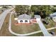 Aerial view of a house with a gray roof and landscaped yard at 6269 Skyline Ct, Spring Hill, FL 34606