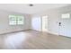 Bright living room featuring hardwood floors and updated doors at 6269 Skyline Ct, Spring Hill, FL 34606