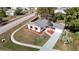 Aerial view of a house with a gray roof and landscaped yard at 6269 Skyline Ct, Spring Hill, FL 34606