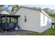 White stucco house with gray trim and covered porch at 6601 S Juanita St, Tampa, FL 33616