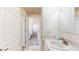 Clean bathroom with a sink, vanity, and view into another bedroom at 6601 S Juanita St, Tampa, FL 33616