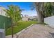 Artificial turf backyard with play area and gravel path at 715 S Himes Ave, Tampa, FL 33609