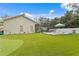 Large backyard with pool, artificial turf, and putting green at 715 S Himes Ave, Tampa, FL 33609