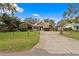 House exterior showcasing a split-level home with stone and wood siding at 715 S Himes Ave, Tampa, FL 33609