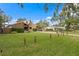 Large grassy front yard with two houses visible at 715 S Himes Ave, Tampa, FL 33609