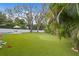 Artificial turf backyard with putting green and play area at 715 S Himes Ave, Tampa, FL 33609