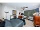 Comfortable bedroom with a ceiling fan and vintage furniture at 7200 Sunshine Skyway S Ln # 12A, St Petersburg, FL 33711