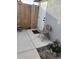 Small patio area with white door and folding chair at 8229 Pinehurst Cir, Tampa, FL 33615