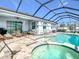 Spacious screened pool and spa with patio furniture at 13444 Golden Lime Ave, Spring Hill, FL 34609