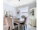 Elegant dining room with a charming table and seating for six at 13444 Golden Lime Ave, Spring Hill, FL 34609