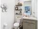 Small bathroom with floating shelves and a modern vanity at 13444 Golden Lime Ave, Spring Hill, FL 34609