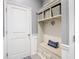 Inviting entryway with built-in bench and storage at 13444 Golden Lime Ave, Spring Hill, FL 34609