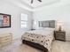 Bright bedroom with carpeted floors and decorative headboard at 13444 Golden Lime Ave, Spring Hill, FL 34609