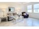 Cozy living room with a sofa, recliner, and stylish coffee table at 13444 Golden Lime Ave, Spring Hill, FL 34609