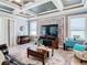 Living room with coffered ceiling and fireplace at 13444 Golden Lime Ave, Spring Hill, FL 34609