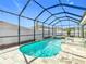 Relaxing screened pool and spa with tiled coping at 13444 Golden Lime Ave, Spring Hill, FL 34609