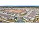Aerial view of a residential neighborhood with a large empty lot at 13444 Golden Lime Ave, Spring Hill, FL 34609