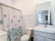Clean bathroom with shower/tub combo and updated vanity at 13444 Golden Lime Ave, Spring Hill, FL 34609