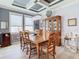 Formal dining room with wood table and hutch at 13444 Golden Lime Ave, Spring Hill, FL 34609