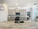 Eat-in kitchen boasts granite countertops and stylish pendant lighting at 13444 Golden Lime Ave, Spring Hill, FL 34609