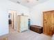 Bedroom with two wooden armoires and access to another room at 13444 Golden Lime Ave, Spring Hill, FL 34609