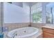 Bathroom with large garden tub, and window at 1521 Brilliant Cut Way, Valrico, FL 33594