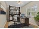 Home office with built-in shelves and modern desk at 2125 Dartmouth N Ave, St Petersburg, FL 33713