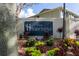 The Hamptons community sign surrounded by colorful landscaping at the entrance at 237 Thorn Tree Pl # 237, Brandon, FL 33510