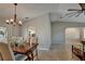 Dining room with wooden table, neutral decor and access to the patio at 26159 Constantine Rd, Punta Gorda, FL 33983