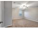 Bedroom with ceiling fan, neutral walls, and carpeted floor at 36229 Jenny Lynne Cir, Zephyrhills, FL 33541