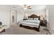 Spacious bedroom with large bed, ensuite bathroom access, and ample natural light at 3632 Bellmeade Ct, Wesley Chapel, FL 33543