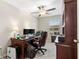 Home office with a large desk, comfortable chair, and plenty of natural light at 3632 Bellmeade Ct, Wesley Chapel, FL 33543