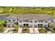 Three-unit townhouse building with attached garages and landscaping at 3632 Bellmeade Ct, Wesley Chapel, FL 33543