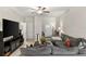 Living room with sectional sofa and view of entryway at 3632 Bellmeade Ct, Wesley Chapel, FL 33543
