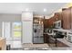 Bright kitchen with stainless steel appliances and access to backyard at 3632 Bellmeade Ct, Wesley Chapel, FL 33543