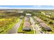 Aerial view of community near a pond and lush greenery at 3632 Bellmeade Ct, Wesley Chapel, FL 33543