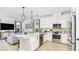 Modern kitchen with island, stainless steel appliances, and open floor plan at 748 Steel Dr, Apollo Beach, FL 33572