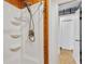Updated shower with three shelves and wood accent wall at 8014 Peach Dr, Temple Terrace, FL 33637