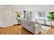 Light and airy entryway with hardwood floors and access to the living room at 8014 Peach Dr, Temple Terrace, FL 33637
