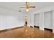 Spacious bedroom with wood floors and mirrored closet doors at 8014 Peach Dr, Temple Terrace, FL 33637