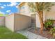 Private backyard with wooden fence and landscaping at 8014 Peach Dr, Temple Terrace, FL 33637