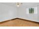 Charming bedroom with wood floors and window with blinds at 8014 Peach Dr, Temple Terrace, FL 33637