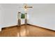 Bright bedroom featuring wood flooring and ceiling fan at 8014 Peach Dr, Temple Terrace, FL 33637