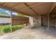 Covered carport parking with wooden dividers at 8014 Peach Dr, Temple Terrace, FL 33637
