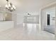 Bright living room with tile floors and a view to the backyard at 901 Normandy Trace Rd, Tampa, FL 33602